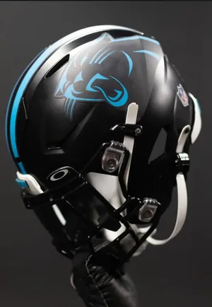 A Close-up Shot Of A Black Football Helmet Wallpaper