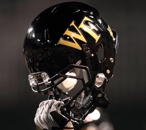 A Close-up View Of A Shiny Football Helmet Wallpaper