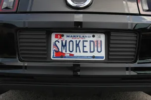 A Close-up View Of A Vintage Car's License Plate Wallpaper