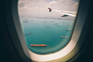 A Closer Ocean View From The Plane Window Wallpaper