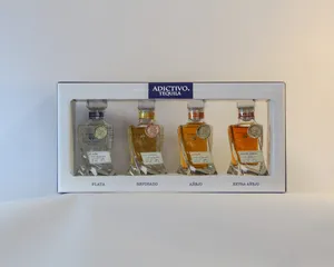 A Collection Of Adictivo Miniature Bottles Wallpaper