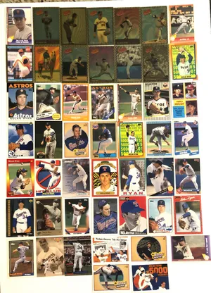 A Colorful Collection Of Vintage Baseball Cards Spread Across The Table. Wallpaper