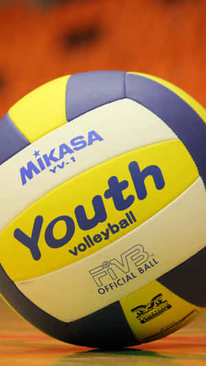 A Colorful Volleyball Ball In Mid-air Wallpaper