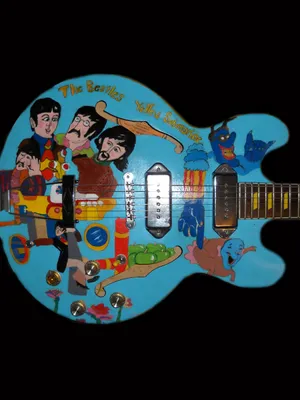 A Colorful Yellow Submarine Sailing Through An Underwater World Of Adventure Wallpaper