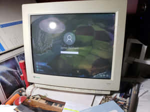 A Computer Monitor On A Desk Wallpaper