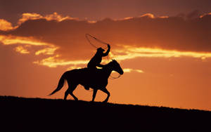 A Cowboy On A Horse Wallpaper