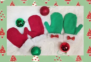 A Cozy Pair Of Knitted Mittens On A Wooden Table Wallpaper