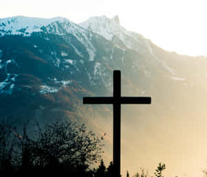 A Cross In The Middle Of A Field Wallpaper