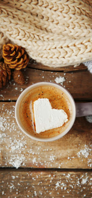 A Cup Of Hot Chocolate With A Heart Shaped Marshmallow Wallpaper