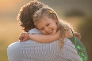 A Dad Bringing Joy To His Little Girl Wallpaper