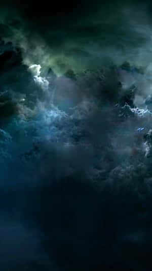 A Dark Sky With Clouds And A Moon Wallpaper