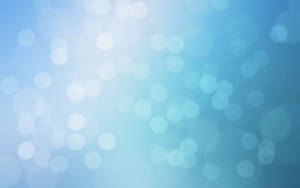 A Dazzling Background Of Light-blue Bokeh Wallpaper