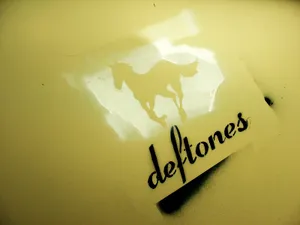 A Deftones Fan Listening To Their Favorite Tunes Wallpaper