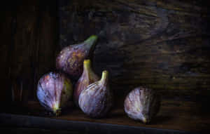 A Delicious Cluster Of Ripe Purple Figs. Wallpaper