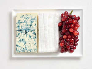 A Delicious Slice Of Blue Cheese, Perfect For Adding Flavor To Any Dish. Wallpaper