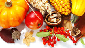 A Delicious Spread Of Autumn Food On A Wooden Table Wallpaper