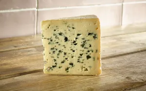 A Delicious Wedge Of Blue Cheese, Perfect For Salads Or Just For Snacking