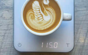 A Delightful Cup Of Fresh Milk Blending With Aromatic Coffee Wallpaper