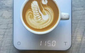 A Delightful Cup Of Fresh Milk Blending With Aromatic Coffee Wallpaper