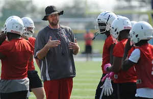 A Determined Football Coach Planning Strategies Wallpaper