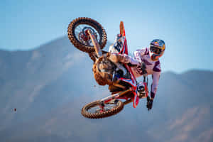 A Dirt Bike Rider In Mid Air Wallpaper