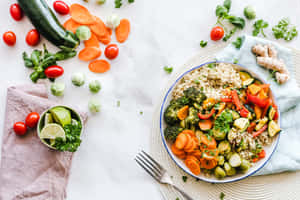 A Diverse Dish Of Healthy Grains And Colorful Vegetables Wallpaper