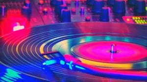 A Dj Turntable With Colorful Lights On It Wallpaper