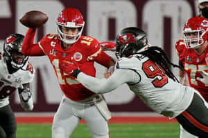 A Dynamic Football Tackle Moment Wallpaper