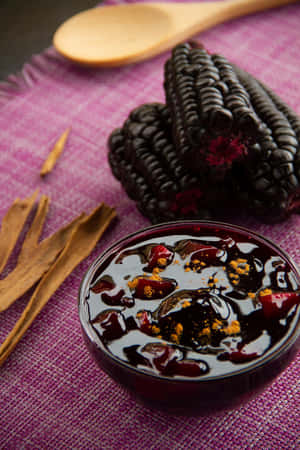 A Field Of Gorgeous Purple Corn On The Cob Growing In The Sun. Wallpaper