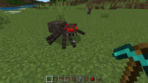 A Fierce Minecraft Spider Lurking In The Darkness Wallpaper