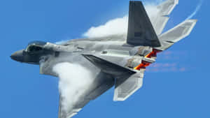 A Fighter Jet Flying Through The Air Wallpaper