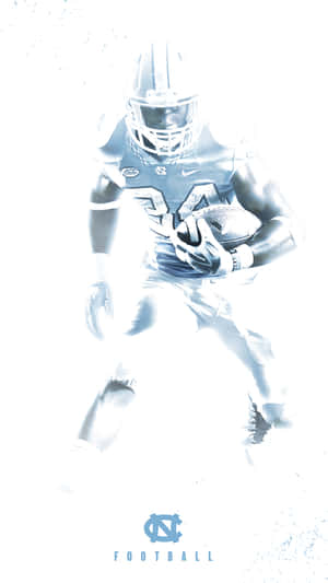 A Football Player Is Running With A Ball Wallpaper