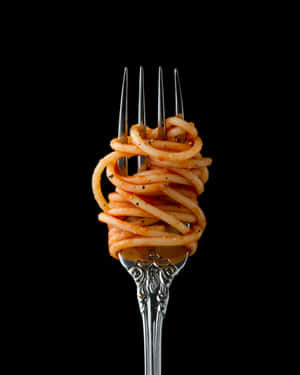 A Fork With Spaghetti On It Wallpaper