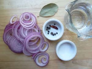 A Fresh Bunch Of Purple Onions As Part Of A Healthy Meal Wallpaper