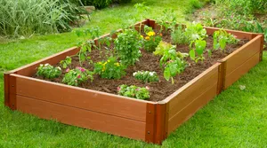 A Freshly Manicured Garden Bed In Full Bloom Surrounded By Vibrant Foliage Wallpaper