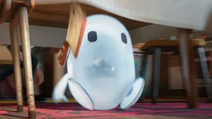 A Ghost Sitting On A Table In A Room Wallpaper