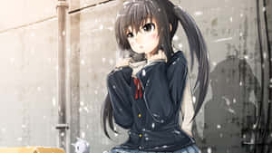 A Girl In A Winter Coat Sitting On A Snowy Sidewalk Wallpaper