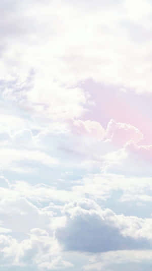 A Girl Is Flying A Kite In The Sky Wallpaper