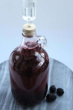 A Glass Of Delicious Blackberry Wine Wallpaper