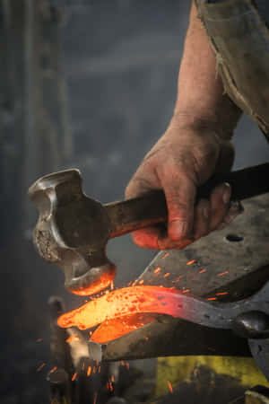 A Glimpse Inside The World Of A Professional Blacksmith Wallpaper