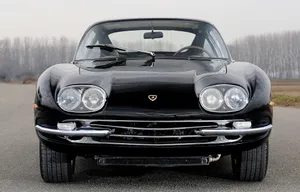 A Glorious View Of The Lamborghini 400 Gt Against A Fiery Skyline Wallpaper