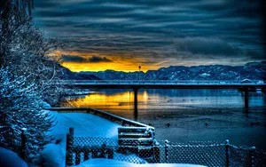 A Gorgeous Sunset Seen Through A Tablet Wallpaper