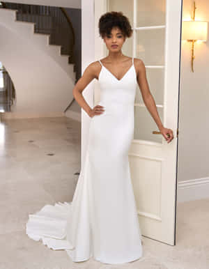 A Gorgeous White Bride's Dress On A Soft Blue Background