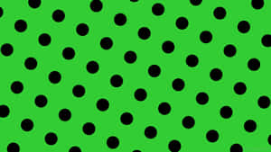 A Green Background With Black Dots Wallpaper