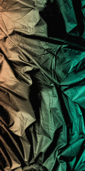 A Green, Brown, And Orange Fabric Background Wallpaper