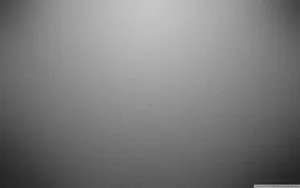 A Grey Background With A Light Shining On It Wallpaper