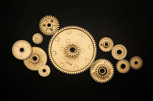 A Group Of Gears On A Black Background Wallpaper