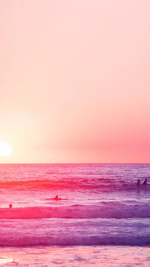 A Group Of People Are Surfing In The Ocean Wallpaper