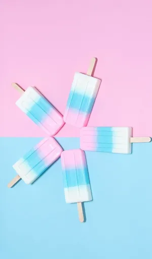 A Group Of Popsicles On A Pink And Blue Background Wallpaper