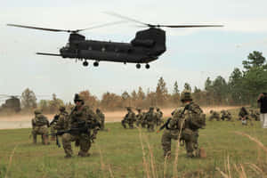 A Group Of Soldiers Walking In A Field Wallpaper